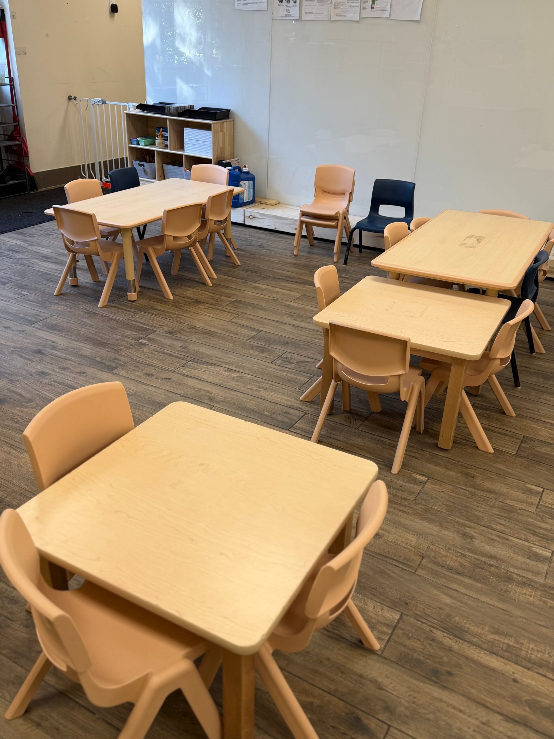 Preschool tables and chairs arranged for group learning activities